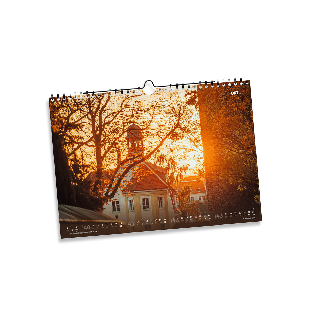 Oktober 2027: Donatstorblick in Freiberg zwischen herbstlichen Bäumen im warmen Gegenlicht.